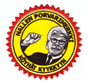 Runt halarmärke med en man som pekar och text på finska